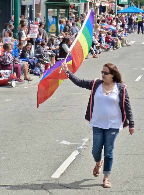 Woman with rainbow flag.